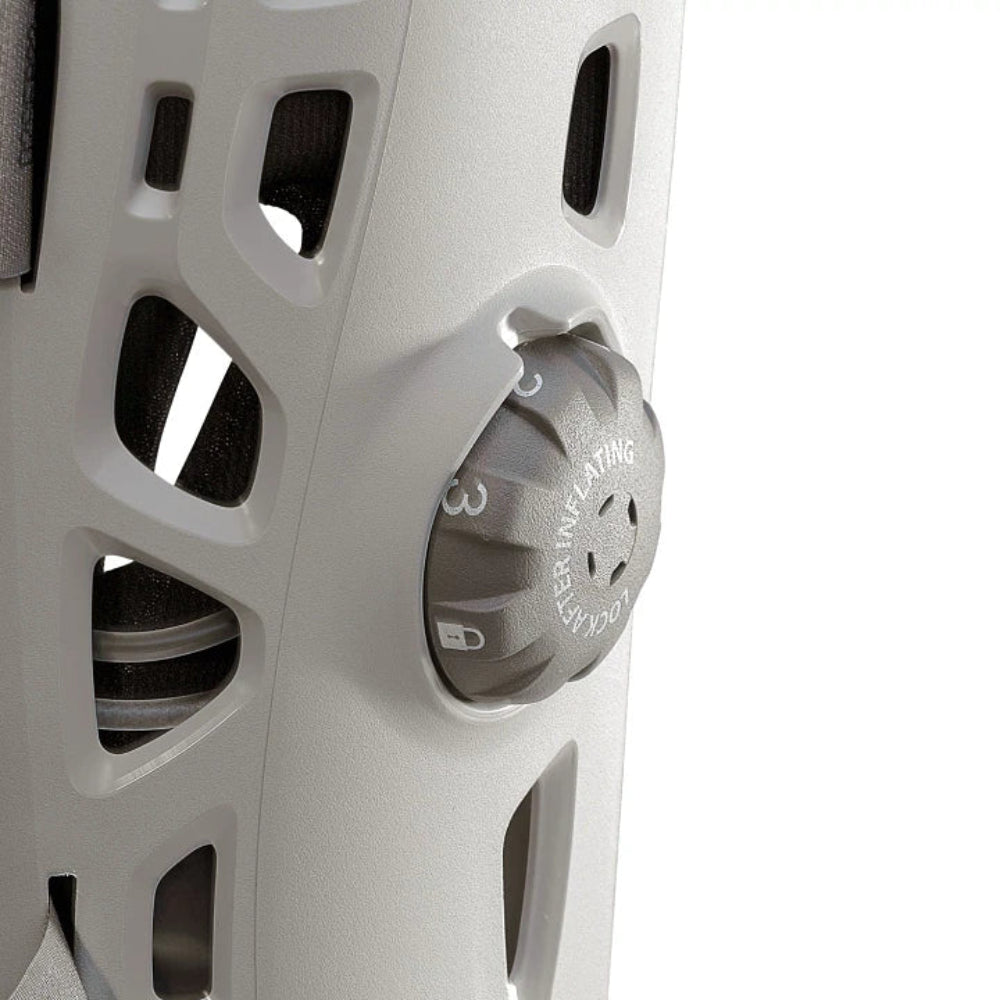 A detailed close-up of the integrated inflation system dial, allowing users to customize the compression level of each individual aircell.