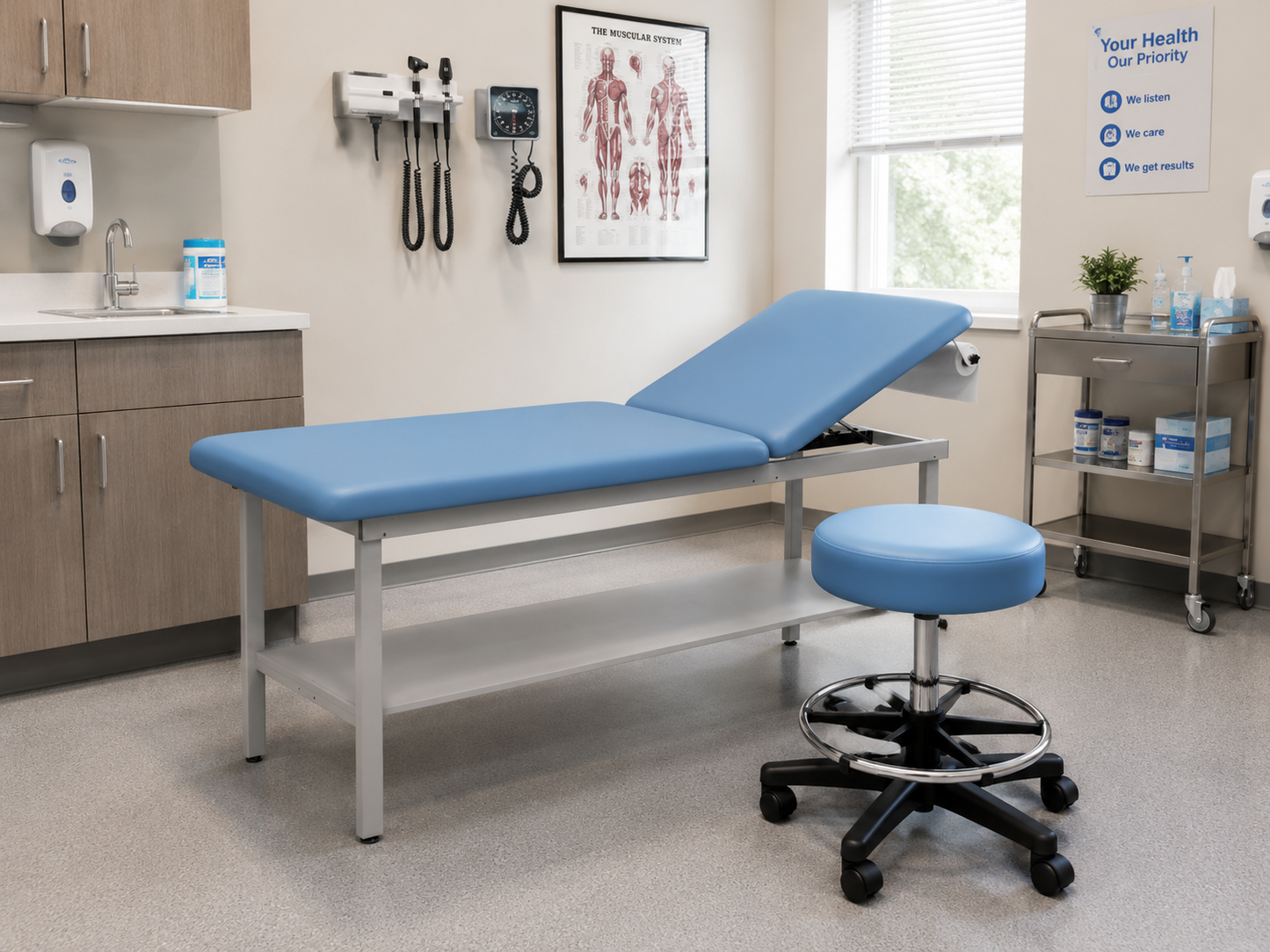 Medical exam room with a blue exam table with raised backrest, a matching blue wheeled stool, cabinets, wall-mounted diagnostic instruments, and a supply cart