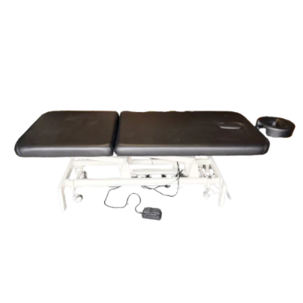 A view of the table's undercarriage highlighting the electric motor, control cables, and sturdy base supports.