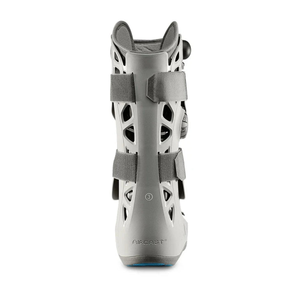 A full rear view of the Elite walker boot, showing the anatomical design of the tall shell that provides maximum support for the lower leg.