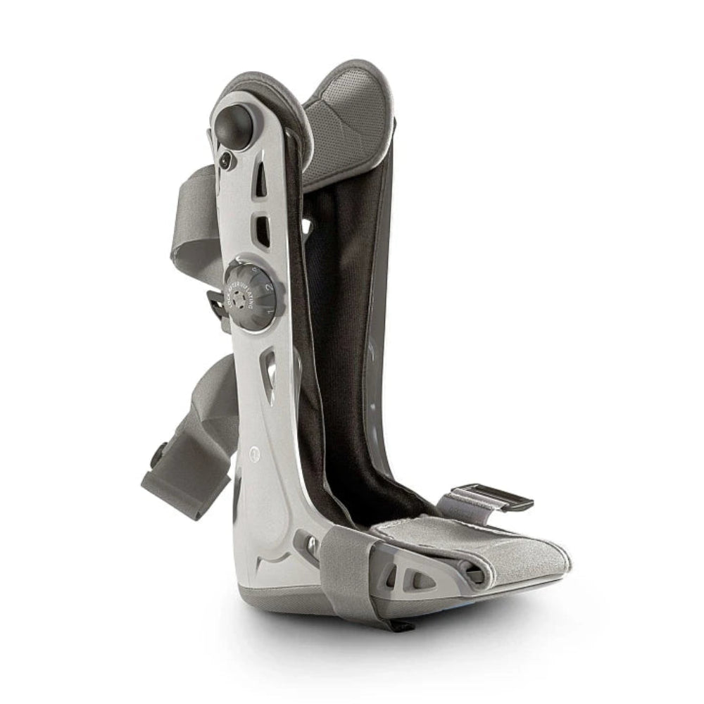 A direct side profile of the Elite walking boot, showcasing the sleek, semi-rigid shell and the integrated inflation dial system.