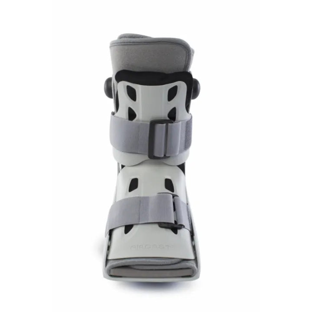 A direct front view of the short walking boot, showing the integrated inflation system dial and the open-toe design for comfort.