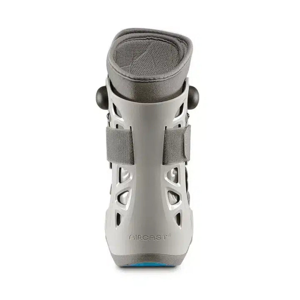 A direct rear view of the short walking boot, showing the integrated inflation system dial and the open-toe design for comfort.