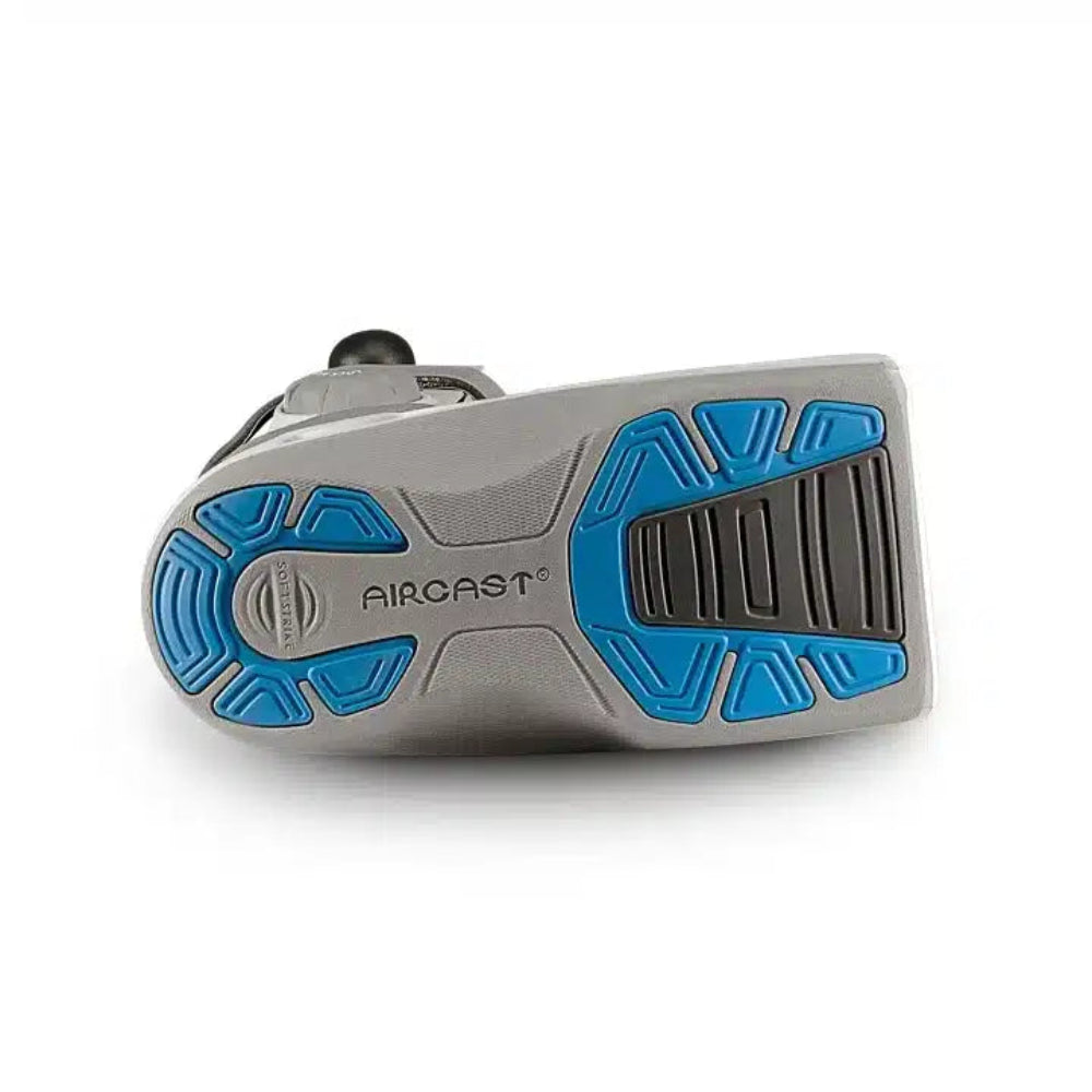 A rear-angle view focusing on the blue SoftStrike technology on the heel of the sole, designed to absorb shock while walking.