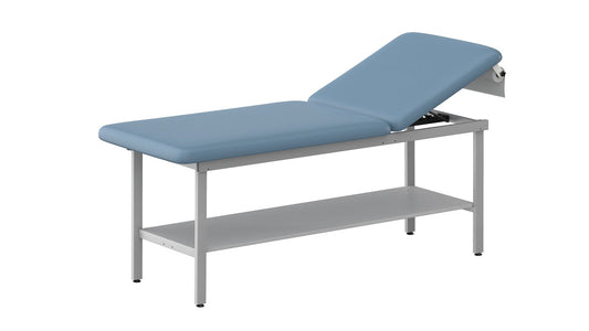 Blue upholstered stationary exam table with adjustable backrest, grey steel frame, lower storage shelf, and paper roll holder on a white background.