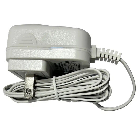 White Chattanooga replacement power adapter charger with coiled power cord for Cefar TENS and NMES units on a white background.

