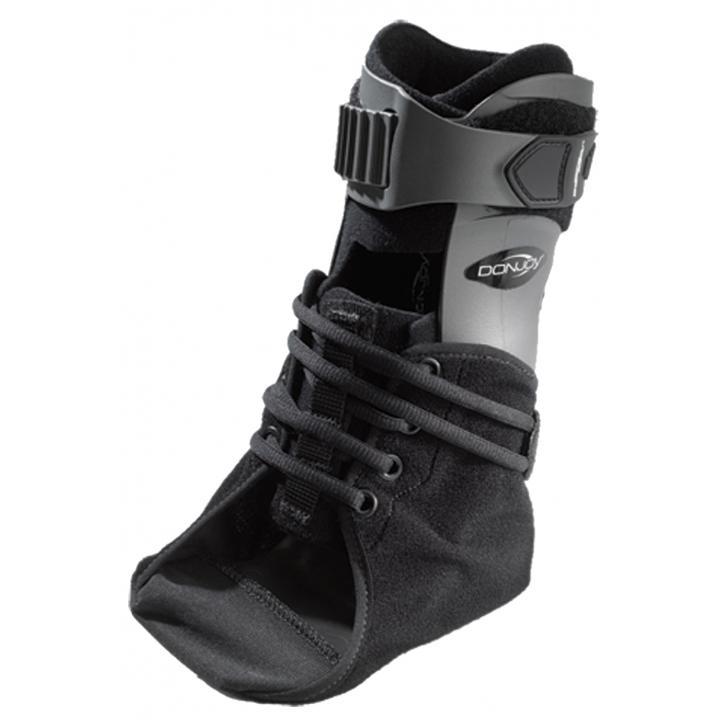 DonJoy Velocity ES Extra Support Ankle Brace for the left foot, featuring a rigid black shell, speed-lacing system, and padded ankle collar against a white background.