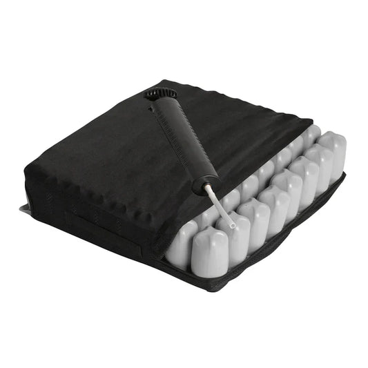 Black inflatable air cell wheelchair seat cushion featuring a removable cover, exposed interconnected air cells, and an attached manual hand inflation pump on a white background.