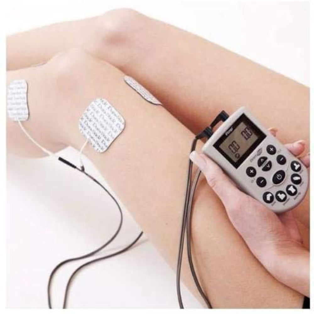 A person using the Empi Direct TENS unit on their leg, demonstrating the electrode pad placement for localized pain management.