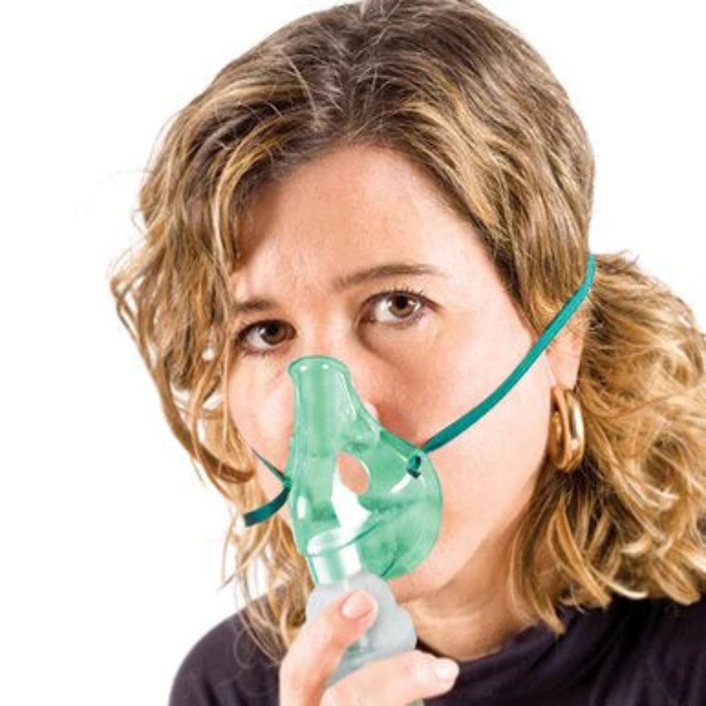 A lifestyle image of an adult woman using the nebulizer mask, illustrating effective treatment for upper and lower respiratory tracts.