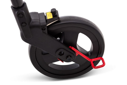 Close-up view of the Nexus 3 rollator curb climber foot lever attachment mounted near the black caster wheel on a plain white background.