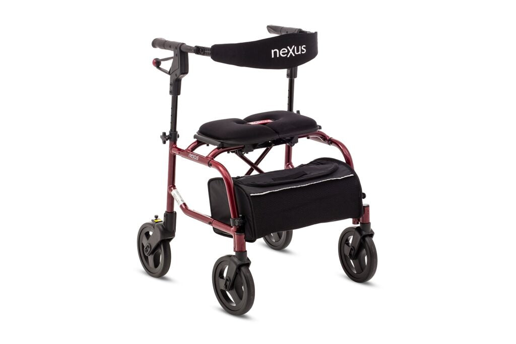 The Nexus 3 rollator in a classic burgundy red finish, featuring the signature cross-folding frame that allows it to stand independently when folded.