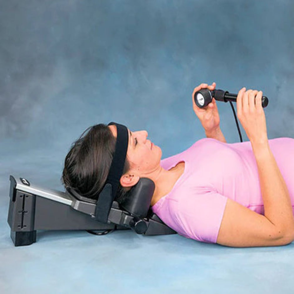 A close-up of a user securing the head strap on the Saunders device, showcasing the ease of use for independent home therapy.