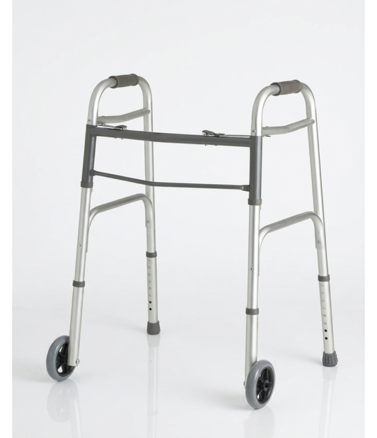 A standalone silver aluminum folding medical walker featuring front wheels and black rubber hand grips, shown on a plain white background