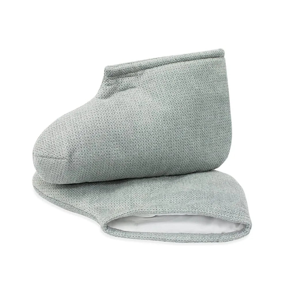 A pair of tan insulated boots included in the ComforKit, designed to retain therapeutic heat during a paraffin foot treatment.