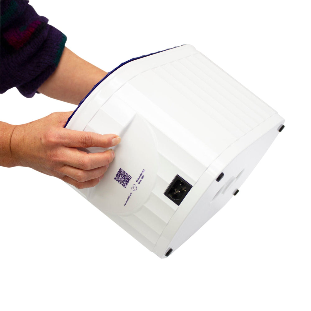 A view of the Therabath Pro TB6 power connection point, featuring a standard IEC receptacle for the detachable medical-grade power cord.