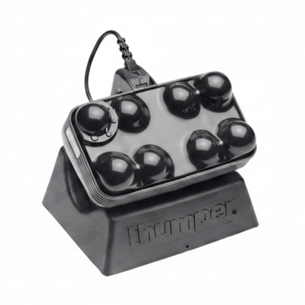 A top-down view of the massage head, showcasing the 8 patented spheres that deliver deep-penetrating percussive energy.