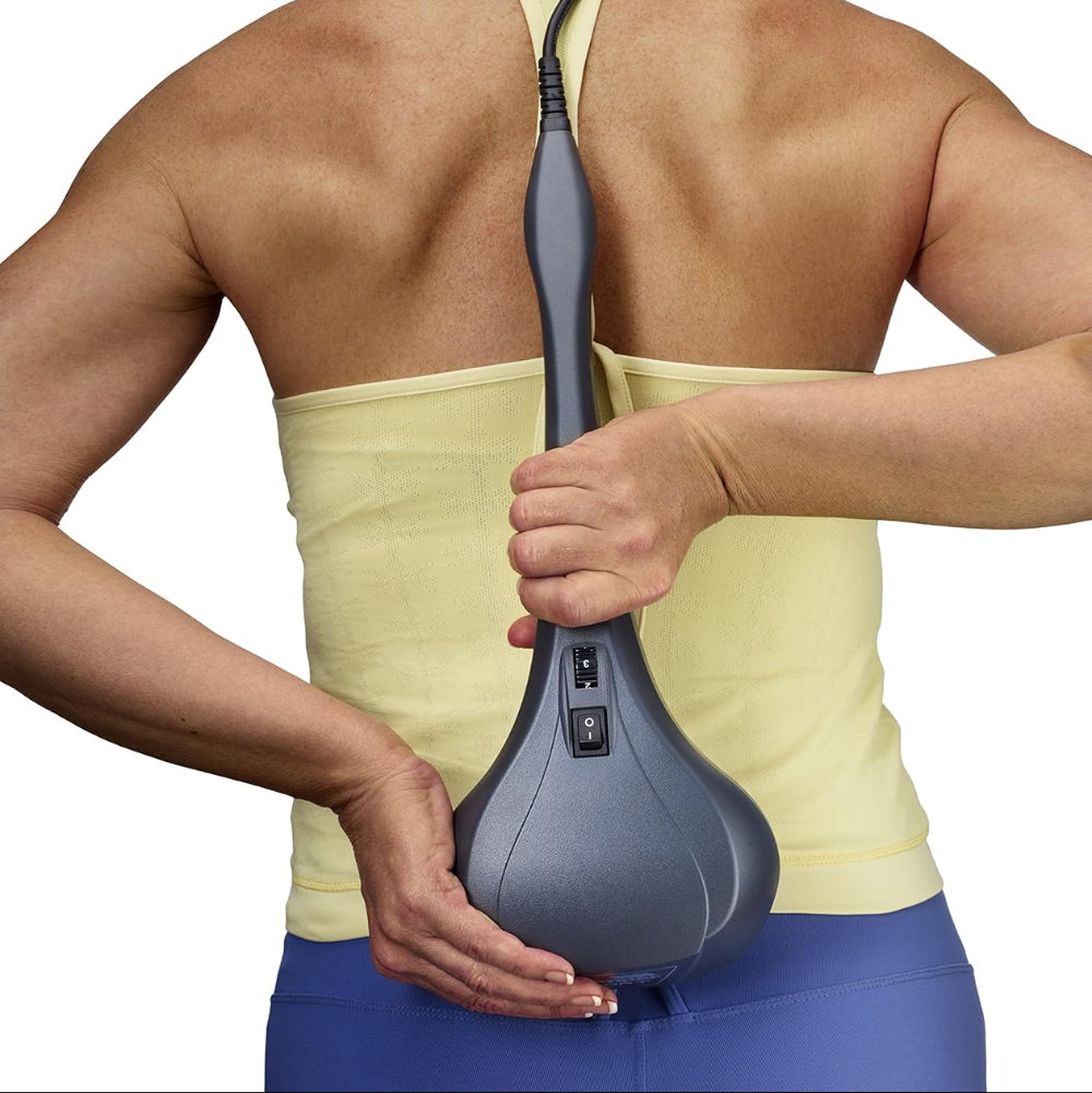 A person using the Thumper Sport on their hamstring, demonstrating the massager's effectiveness for lower back