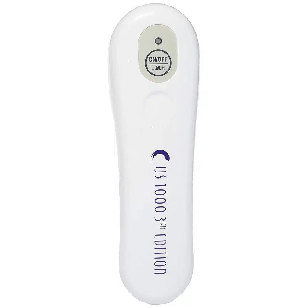 A direct front view of the white US 1000 handheld ultrasound unit, showcasing the ergonomic design and the treatment head.