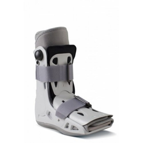 Frontal angled view of the Aircast AirSelect Short walking boot, featuring a durable semi-rigid shell, adjustable distal air-cells for custom compression, and a shock-absorbing rocker sole for natural gait.