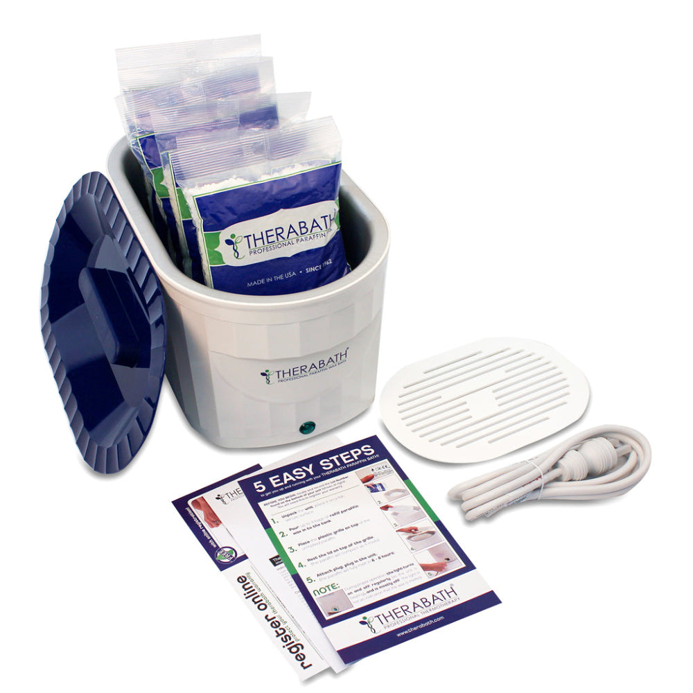 The complete Therabath Pro kit layout, including the TB6 unit, six 1-lb bags of therapeutic paraffin wax, and the integrated safety grille.
