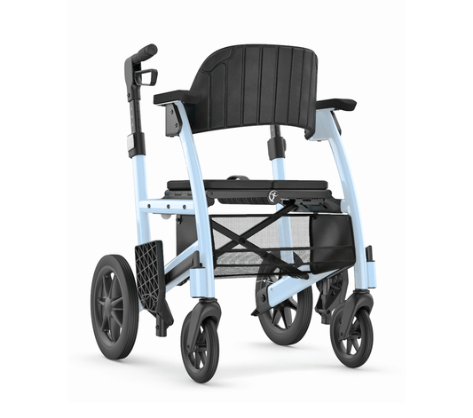 Full angled view of the light blue Triumph Prestige All-in-one Rollator and Transport Chair, featuring a flexible padded backrest and large wheels for smooth indoor and outdoor mobility.